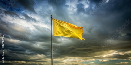 A lone yellow flag billows in the wind against a dramatic, stormy sky, a vibrant contrast of color and weather