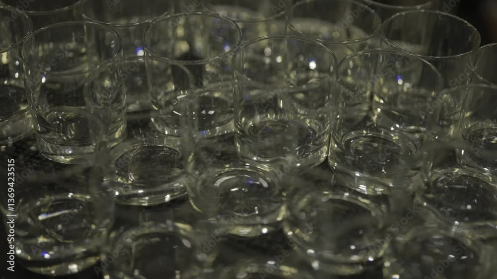 A pristine and beautifully arranged collection of crystal clear glasses, ideal for any celebration or gathering A pristine and beautifully arranged collection of crystal clear glasses, ideal for any celebration or gathering