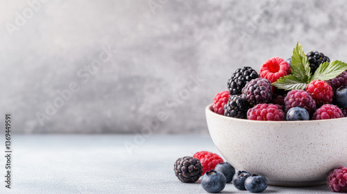 bowl filled with fresh berries including raspberries, blackberries, and blueberries