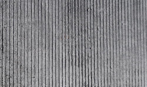 Foto Textured cement road surface, with parallel grooves