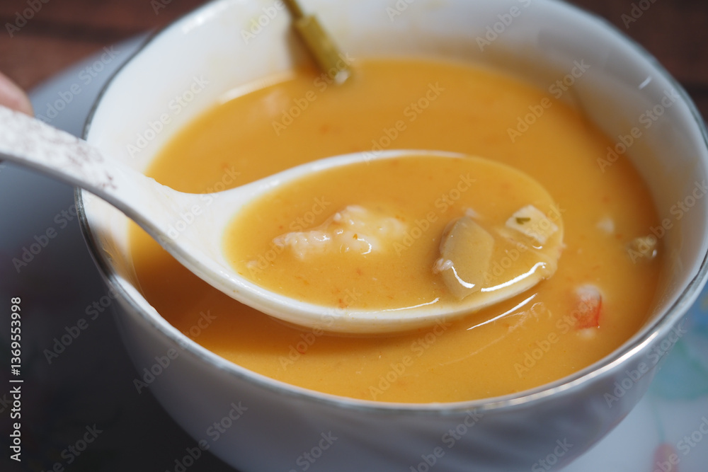 Rich and hearty seafood soup served in a bowl for dinner Rich and hearty seafood soup served in a bowl for dinner