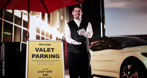 Portrait Of A Handsome Male Valet Holding Car Keys