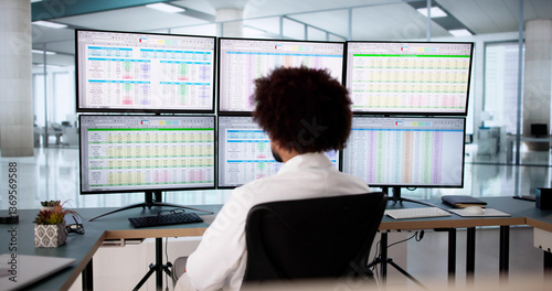 Medical coder analyzes billing codes on hospital computer
