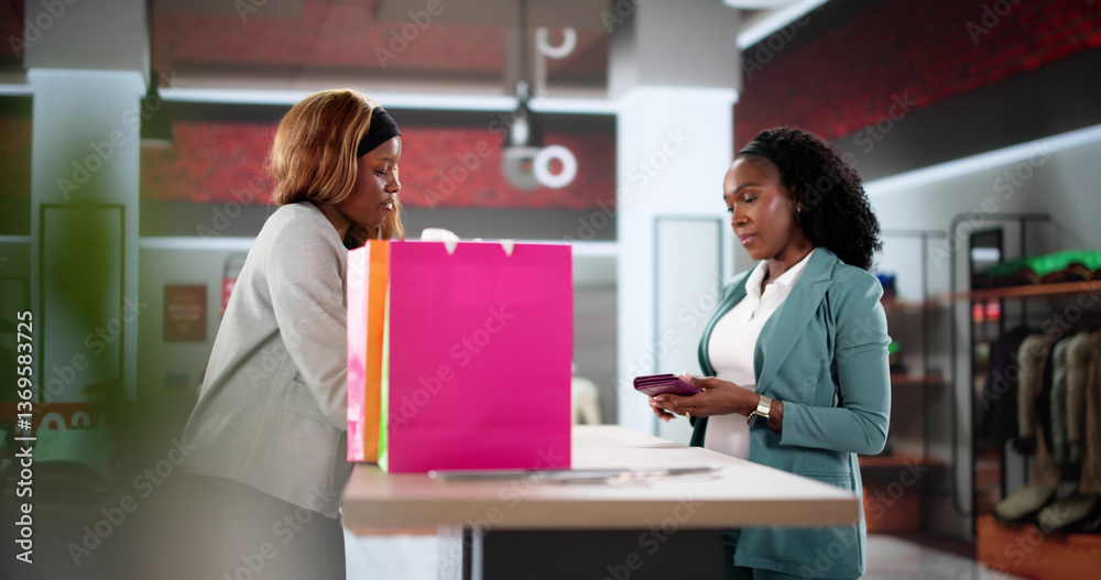 Smiling African American Woman Rings Up Clothes