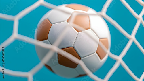 Close-Up of Soccer Ball in Net Against Blue Background