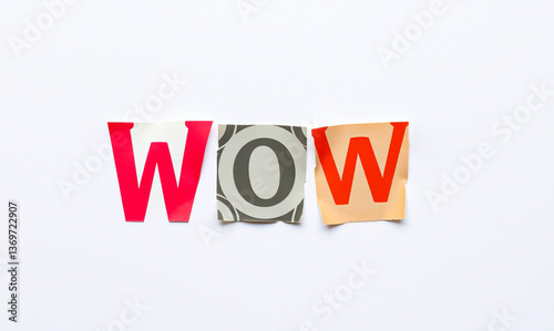 The phrase WOW created using letters placed on a different colored background cut-out from magazines and newspapers