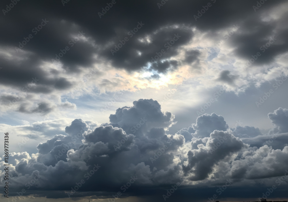 Obraz premium A dramatic sky filled with dark rain clouds gathering and obscuring the horizon.
