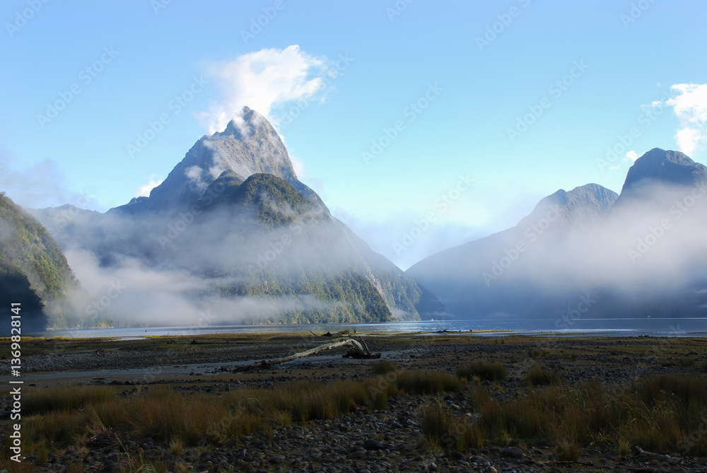 Beautiful Mitre Peak with clouds drifting around it. Milford Sound. New Zealand.