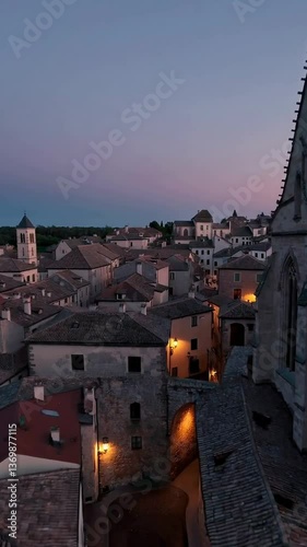 Aerial twilight transition over historic european town’s rooftops and architecture