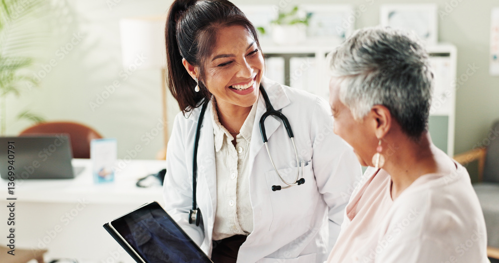 © peopleimages.com - Mature woman, doctor and tablet for xray, support or conversation with cardiology checkup in office. Female person, medical professional and diagnosis talk for senior patient at clinic appointment