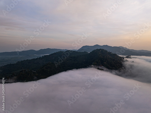 Fototapeta Naklejka Na Ścianę i Meble -  Aerial view Beautiful natural landscape Rainforest mountains in the sunrise or sunset time,Natural scenery tropical forest and fog in asia,Wide angle view drone shot