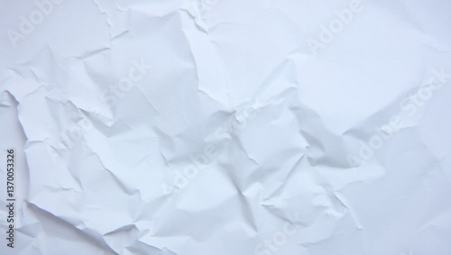 Crumpled paper background with wrinkled texture and a crushed paper ball
