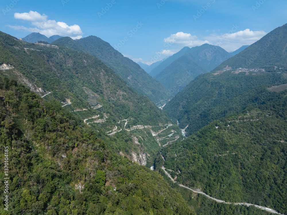 Fototapeta premium Aerial view of beautiful tropical forest mountain landscape in the Yalu Zangbu River valley area, Tibet,China