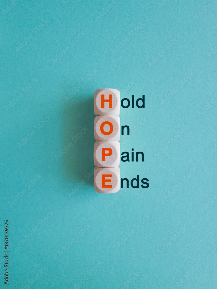 HOPE, hold on, pain ends symbol. Wooden cubes with words 'HOPE, hold on, pain ends. Beautiful blue background. Business, motivational and HOPE, hold on, pain ends concept.