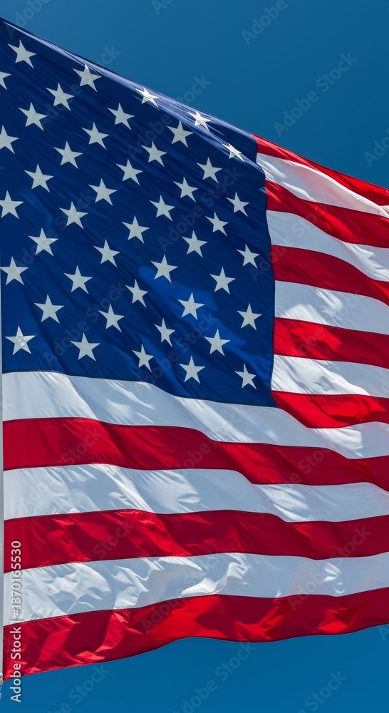 Fototapeta premium Waving Glory: Capturing the Essence of the American Flag under Bright Sky