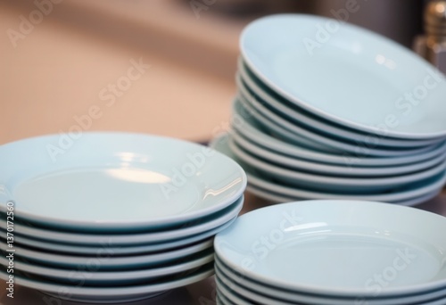 Stacked blue plates ready for dining event restaurant kitchen close-up view culinary setting
