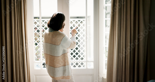 Window, family and mom with child, house and pointing at view, care and parent with baby for scenery. Back, woman and bonding with boy in home, looking or showing neighbourhood to infant in apartment