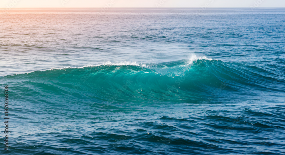Fototapeta premium Sunlit turquoise ocean waves cresting in the distance, seascape beauty