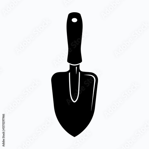 Garden Trowel Silhouette in Lush Green Garden - Gardening Tool Concept