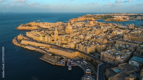 Drone aerial sunset view of Valletta city, church. Capital of Maltese island