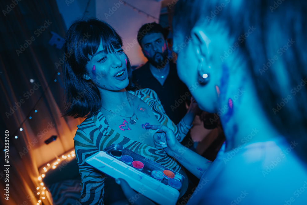 Fototapeta premium A group of young adults having fun at a glow-in-the-dark birthday party, painting each other with neon colors, and celebrating together in a lively, joyful atmosphere.