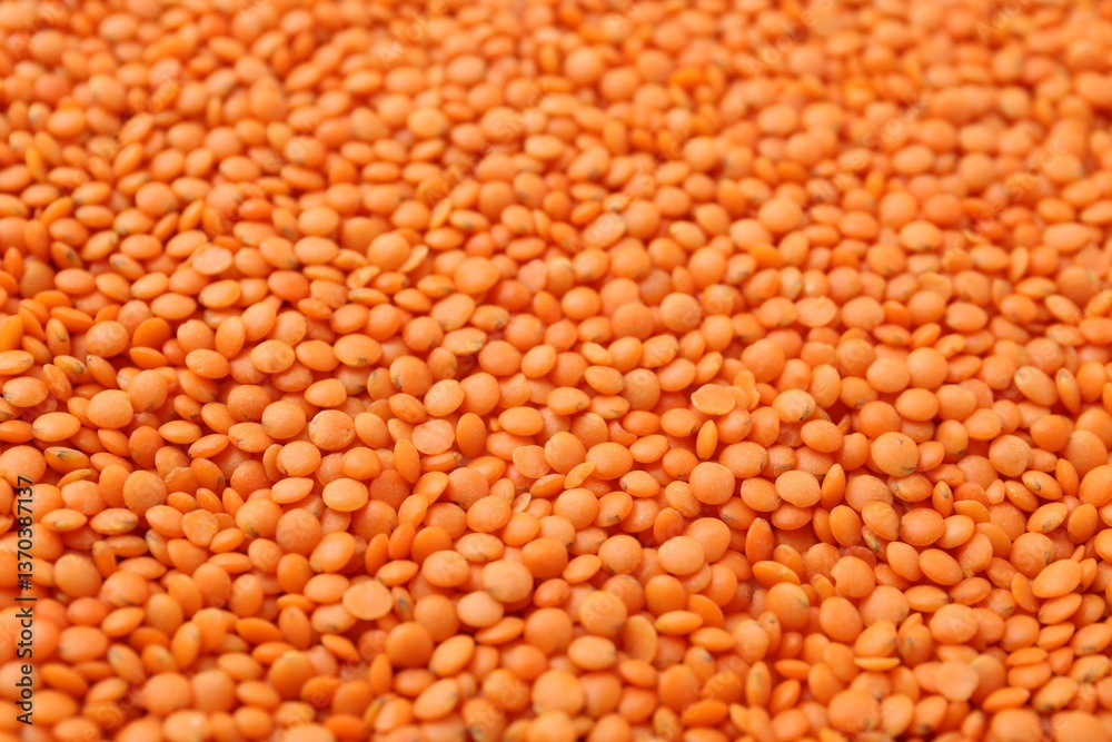 Raw red lentils as background, closeup view Raw red lentils as background, closeup view