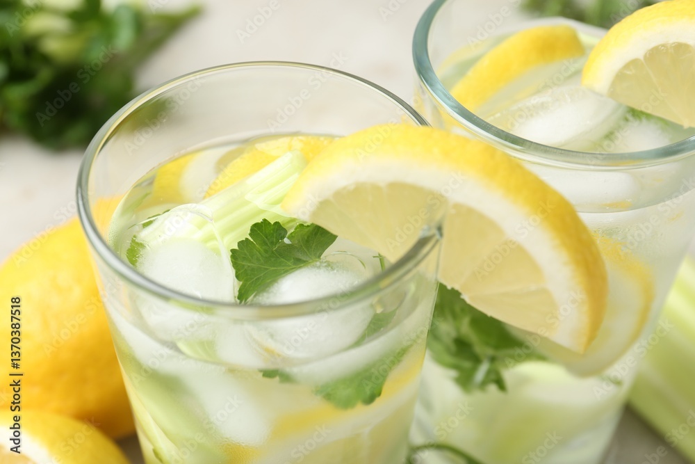 Healthy drink with parsley, lemons and celery on table, closeup Healthy drink with parsley, lemons and celery on table, closeup