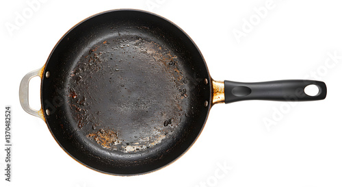 A top down view of a dirty non stick frying pan with a black handle on a white background