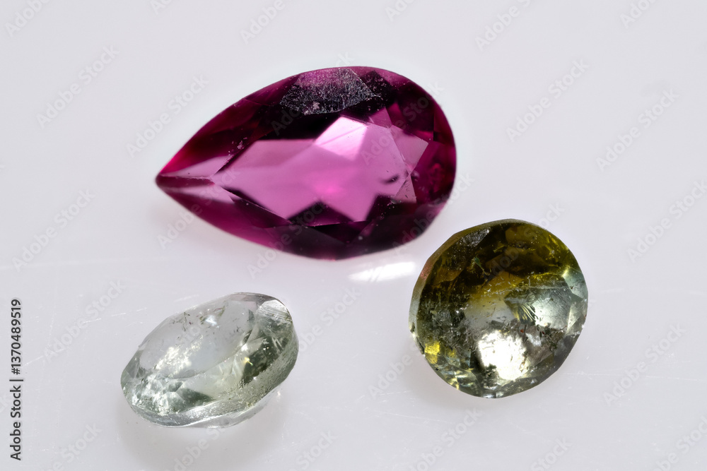 Close-Up of Polished Multicolored Tourmaline Gemstones in Pear and Oval Shapes Close-Up of Polished Multicolored Tourmaline Gemstones in Pear and Oval Shapes