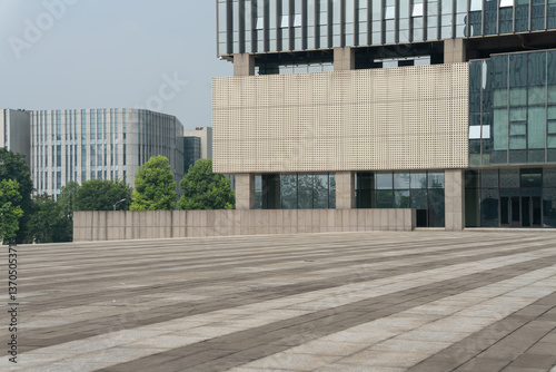 Wallpaper Mural empty concrete ground in front of modern office buildings in downtown. floor for copy space Torontodigital.ca