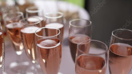 pink champagne in a glass at a party