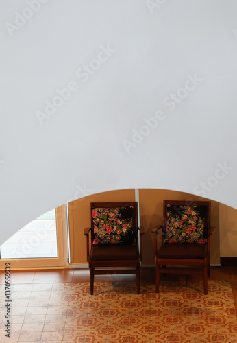 Sofa antique put Infront the exit door and grey wall curve, retro style