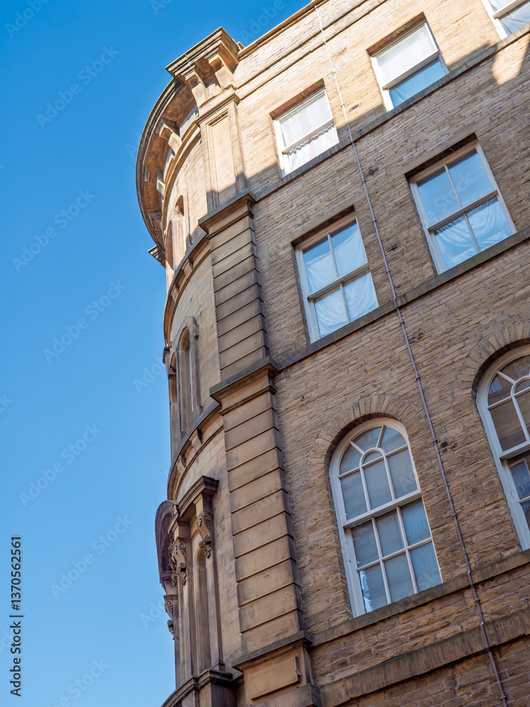 corner of a tall 19th century neoclassical building in the Bradford Little Germany District corner of a tall 19th century neoclassical building in the Bradford Little Germany District