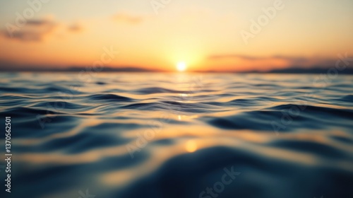 A beautiful sunset reflecting upon the surface of ocean water