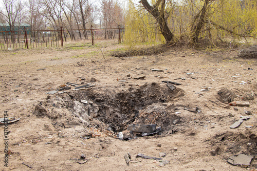 Wallpaper Mural A crater from a drone strike on the embankment on Pobedy in Ukraine in Dnepr Torontodigital.ca