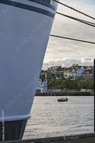 Obraz na płótnie Classic expedition cruiseship cruise ship liner Delphin docked at terminal in Thorshavn Thorshaven, Faroe Islands with city skyline fjord landscape in background during Arctic Circle summer cruising w salonie