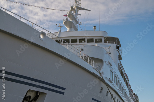 Obraz na płótnie Classic expedition cruiseship cruise ship liner Delphin docked at terminal in Thorshavn Thorshaven, Faroe Islands with city skyline fjord landscape in background during Arctic Circle summer cruising w salonie