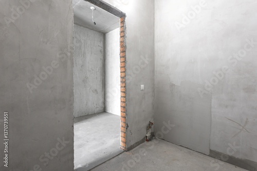 interior of the apartment without decoration in gray colors. rough finish