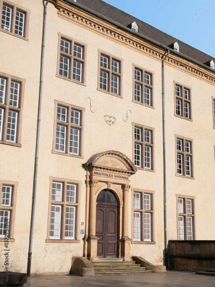 Fototapeta premium Former National Library building next to the Cathedral Notre-Dame of Luxembourg in rue Notre-Dame, Boulevard Roosevelt, Luxembourg City