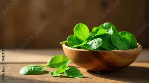 Freshly Harvested Green Leafy Vegetables in a Rustic Wooden Bowl, Bathed in Sunlight on a Wooden Surface
