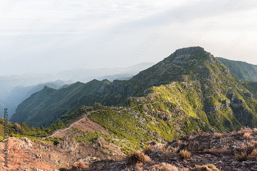 Fototapeta premium Pico Ruivo hiking path under soft sunlight, dramatic mountain scenery in Madeira Portugal