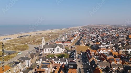 Aerial drone video of the coastal town named katwijk aan Zee in the Netherlands.