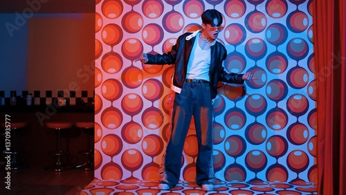 Asian break dancer moving to freestyle music and looking at camera at stage with balloon background. Professional hipster wearing casual outfit and fancy glasses while perform footstep. Regalement.