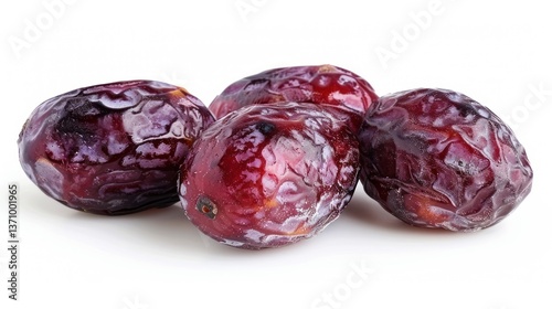 Close-up of Four Juicy, Ripe Dates on White Background