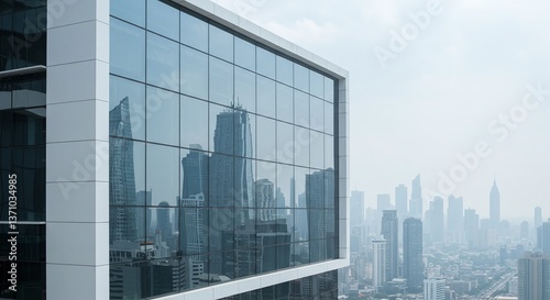 Skyline Reflected: A modern skyscraper with sleek glass windows offers a panoramic view of a sprawling city skyline. The image captures a sense of urban sophistication. 