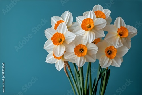Bright Daffodils in a White Vase Against a Light Blue Wall in a Cozy Room Set...