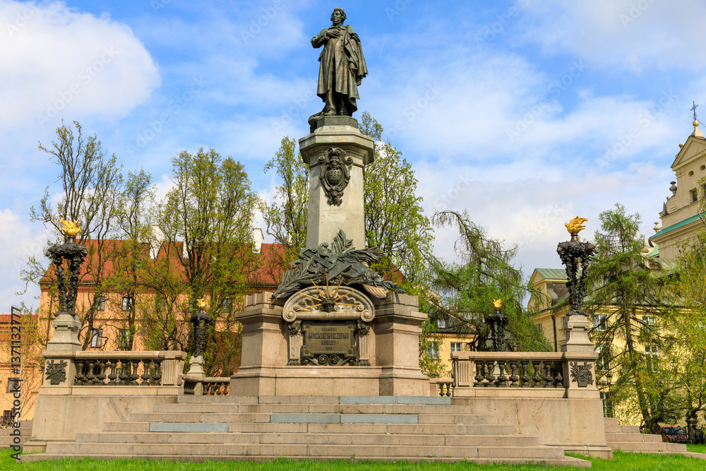 Fototapeta premium Europe, Poland, Warsaw, the Srodmiescie district, Krakowskie Przedmiescie, Adam Mickiewicz Monument. The Neo-Classicist monument was constructed in 1897–1898 by sculptor Cyprian Godebski.