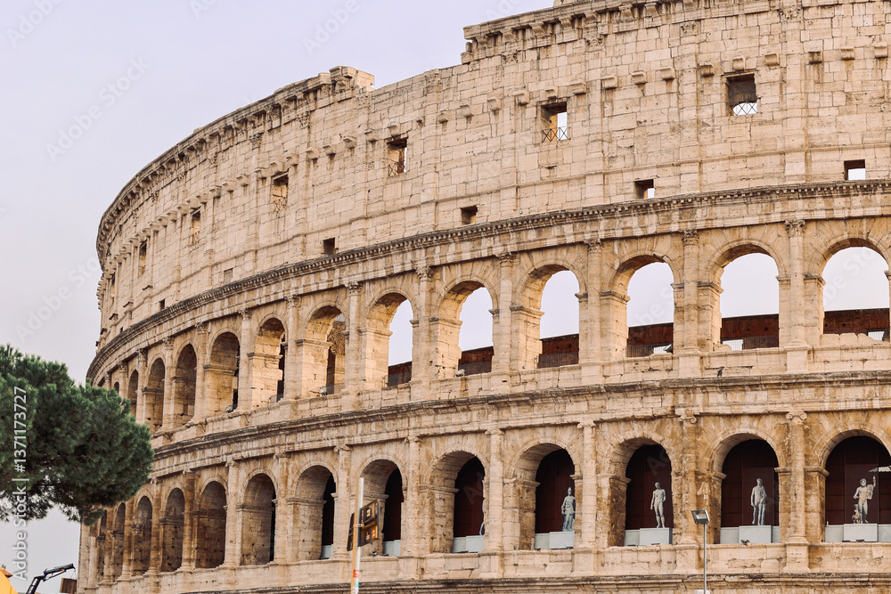 Naklejka premium Panoramic view of old Colosseum in Rome. Beautiful popular of ancient landmark. Famous card of city of Rome, Italy