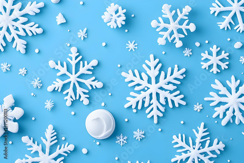 White snowflakes scattered on a light blue background, with a small white round object in the center