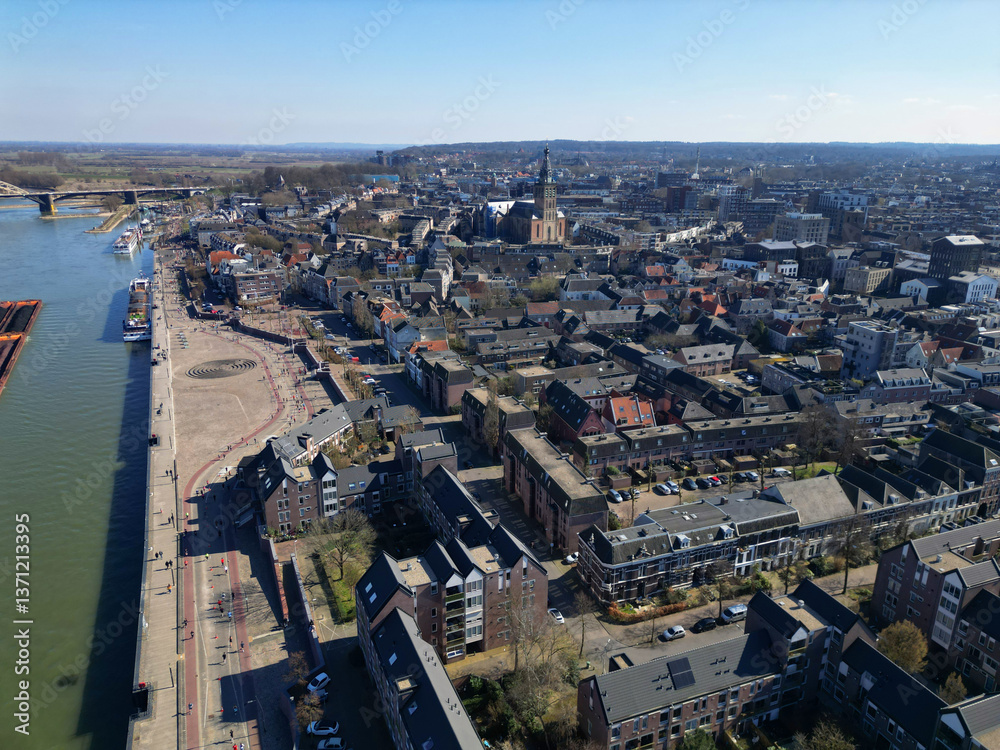 Fototapeta premium Nijmegen Serenity: River Reflections Under a Vast Blue Sky.